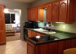 Large kitchen with mirowave, oven, stove top and open cabinets for your groceries.  Large sink for washing dishes - no dish washer in this home.